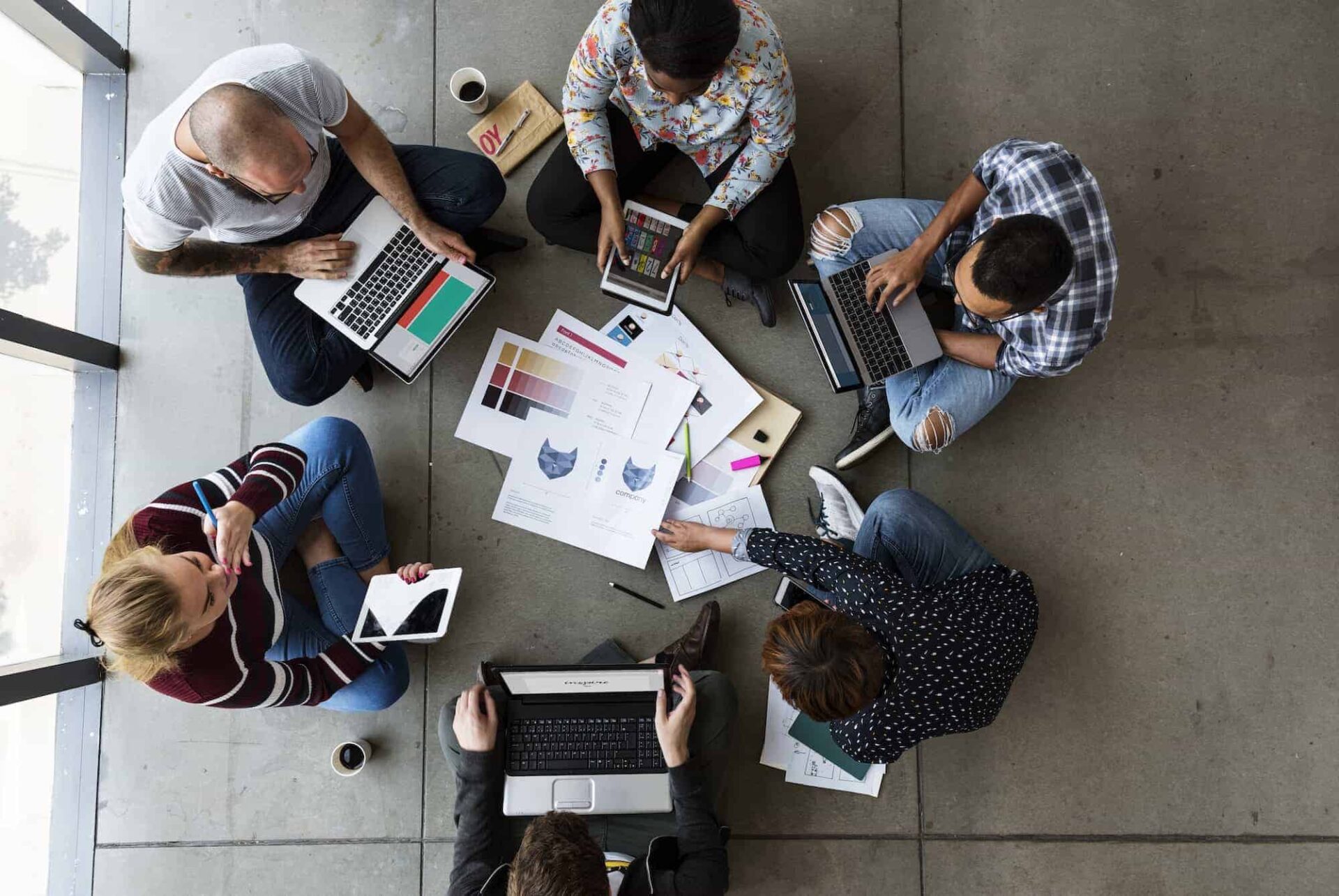 group of people brainstorming sitting on the floor.jpg